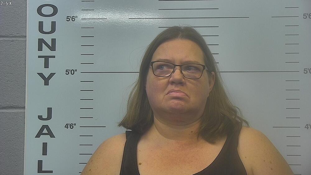 Suspect Tonya Reynolds Mugshot in black shirt